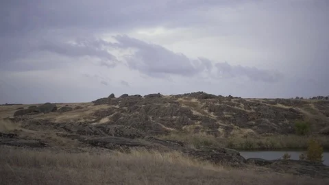 	Dynamic shooting of rocky slopes surrounding a lake Stock Footage 125612812