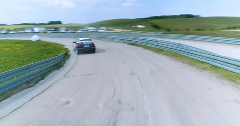 Dynamic shot of car cornering Stock Footage 89418627