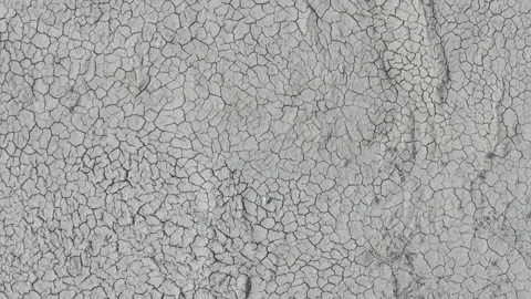 Dynamic shot of cracked soil ground of dried lake Stock Footage 151490366