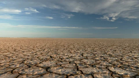 Dynamic shot of cracked soil ground of dried lake or river. Stock Footage 196822370