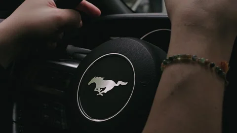 Dynamic shot driving experience on the steering wheel of luxurious Ford Mustang Stock Footage 280687265