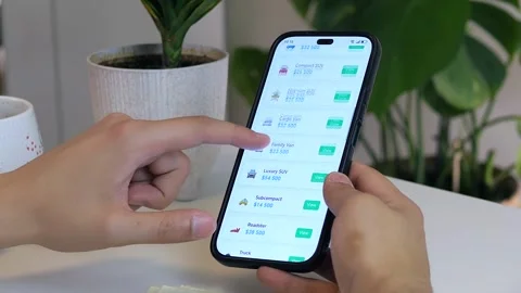 Dynamic shot of hands browsing online car advertisements on a mobile device. 스톡 동영상 314827494