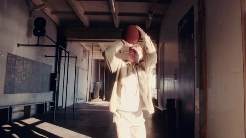 Dynamic Shot of Man Playing Basketball in Warehouse Gym Video stock 308368870