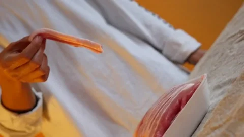 Dynamic shot of raw pork belly placed on cutting board with end transition Stock Footage 155776023