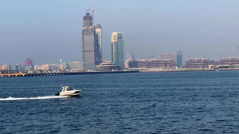 A dynamic shot of a small white speedboat cruising across blue ocean waves .. Vídeos de archivo 347203273