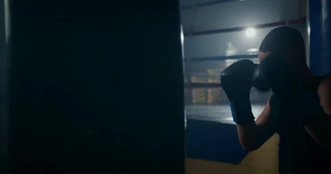 Dynamic shot of young persistent male athlete punching bag training hands Stock Footage 150060821