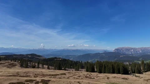 Dynamic Slow Pan Across Layered Mountain Ridges and Alpine Infrastructur Stock Footage 339264964