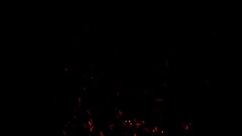 Dynamic sparks flying upward creating burst of energy in dark void Stock Footage 327568831