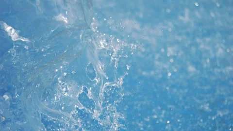 Dynamic splash of clear water creating chaotic ripples in 4k slow motion 120f Stock Footage 283253354