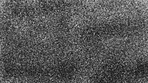 Dynamic spray of black particles on white surface. Fast motion stock animation Stock Footage 329391025