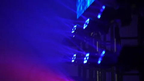 Dynamic stage lighting beams illuminating event production setup Stock Footage 322153373