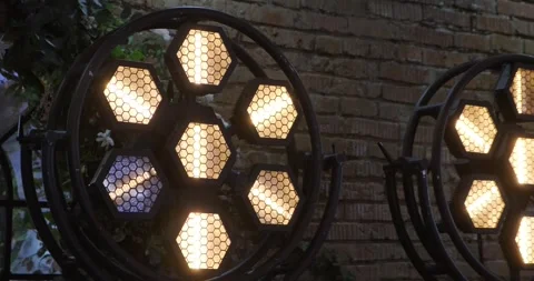Dynamic stage setup featuring illuminated hexagonal lights and a drum kit Stock Footage 316202362