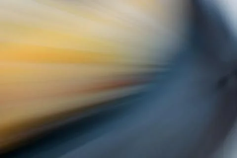 Dynamic starburst with colorful light rays in yellow and blue Illustrazione stock