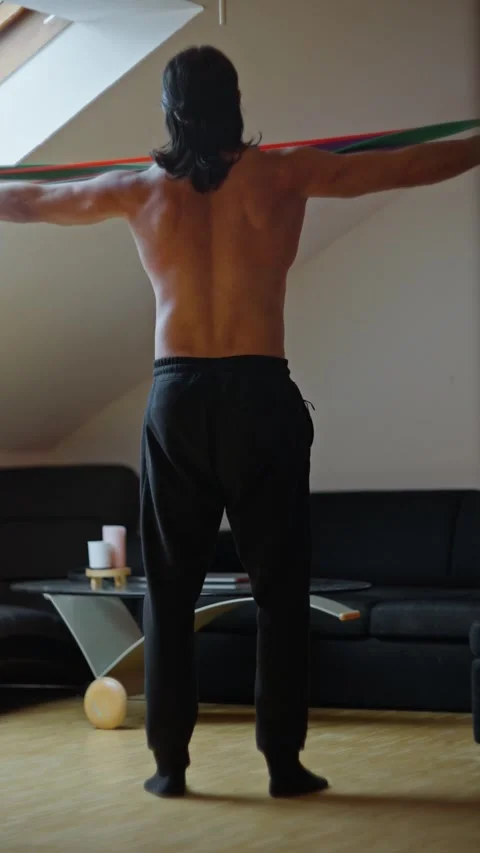 Dynamic Stretching with Resistance Bands for improved performance and Stock Footage 304819138