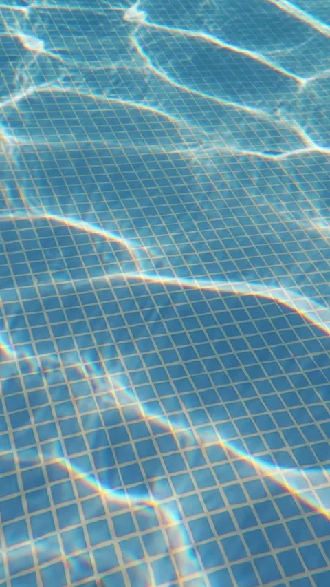 Dynamic Sunlight Caustics Moving Across the Bottom of a Swimming Pool Stock Footage 342502884