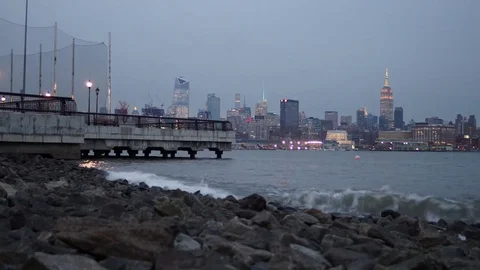 Dynamic Sunset Time-lapse of the Waves in front of the Empire State Building Stock Footage 71130251