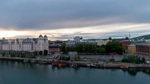 Dynamic sunset view of Oslo's harbor showcasing rapid cloud motion Stock Footage 308194471