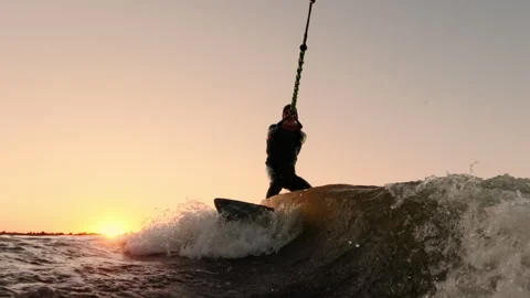 Dynamic Sunset Wakeboarding: Thrilling Moments of Adventure on Water as the Sun Stock-Footage 322552098