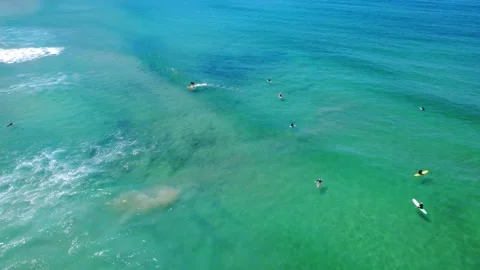 Dynamic Surf Scene at Vibrant Blue Ocean Beach Stock Footage 331624565