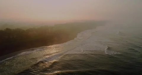 Dynamic Surf Waves Hitting Shoreline in Morning Light Stock Footage 332144880