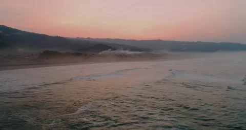 Dynamic Surf Waves Hitting Shoreline from Aerial Perspective Video stock 332149959