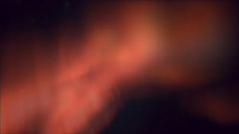 Dynamic swirling pattern of orange and black lines on black background Stockbeeldmateriaal 300776234