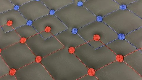 Dynamic textured background with red and blue embroidered dots Фото