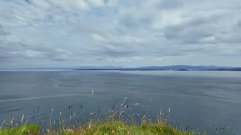 Dynamic time lapse of a calm sea at the coastline of Isle of Skye in rustic Stock Footage 342184927