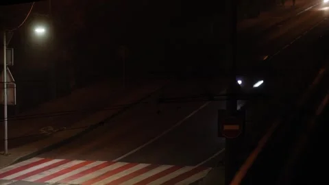 A dynamic time-lapse captures a bustling nighttime city street with cars Stock Footage 292454073