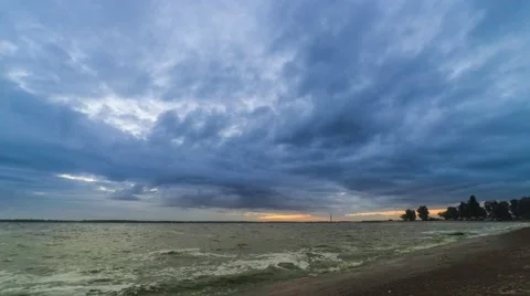 Dynamic time lapse with colorful clouds over water Stock Footage 67866217