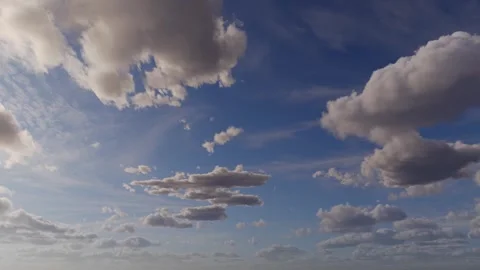 Dynamic Time-Lapse of Fluffy Clouds Drifting Across a Blue Sky Animation Video stock 311317904
