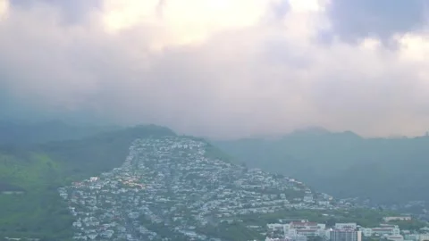 Dynamic time lapse of Honolulu's mountainous backdrop and urban foreground .. Stock Footage 281794390