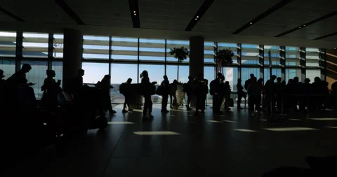 Dynamic time-lapse shot of bustling boarding gate queue at Istanbul Airport Stock Footage 318681664
