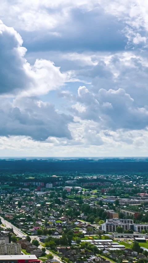 Dynamic Timelapse of Clouds Rolling Over Bustling Cityscape Stock Footage 332066269