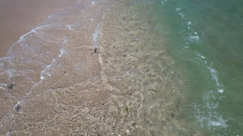 Dynamic Top Down Aerial Video of Waves Crashing on a Beach. Stock Footage 332600197