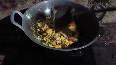 A dynamic top-down shot of stir-frying fresh bean sprouts and yellow tofu. Stock Footage 321939616