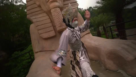 Dynamic traditional dance pose with a Sphinx head background Stock Footage 276349015
