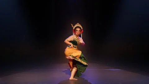 Dynamic Traditional Dancer in Low Squat Performance Pose Stock Photos
