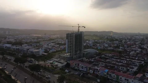 Dynamic urban landscape evolving under the soft glow of an evening sky, fea.. Stock Footage 339033071