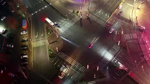 Dynamic Urban Night Time-lapse Aerial View of City Intersection with Streaki Video stock 328290056
