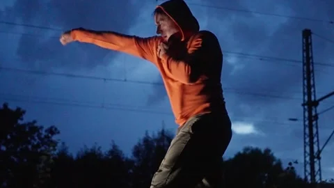 Dynamic Urban Training at Dusk Engage in Fitness Activities with Energy in Stock Footage 317047718