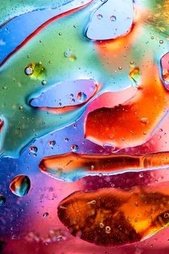 Dynamic Vertical Flow of Colored Oil Bubbles in Liquid Stock Illustration