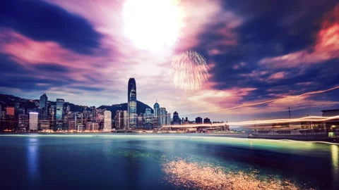A dynamic video sequence showcasing Hong Kong at dusk with vibrant fireworks Stock Footage 344106258