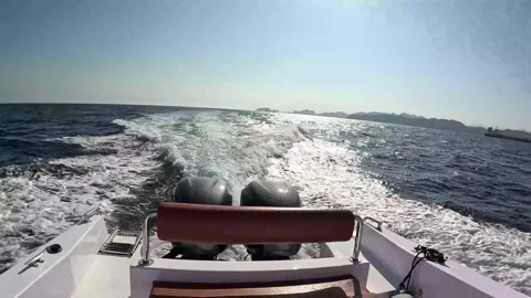 A dynamic view from the back of a speeding boat. Stock Footage 295908345