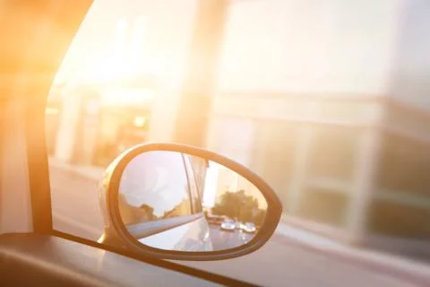 Dynamic view from car on the wing mirror during drive. sun shining. transport Stock-Fotos