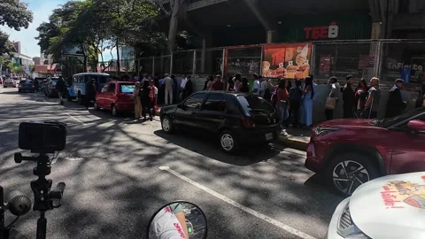 Dynamic View of Queue Outside Polideportivo Parque Miranda in Caracas Stock Footage 331972367
