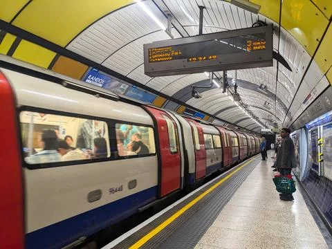 Dynamic view of a Tube train pulling into the iconic Bond Street Underground Stock Photos