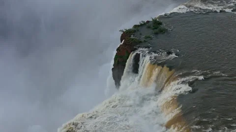 Dynamic water flow at Iguazu Falls thunderingduring the lush rainy summer season Stock Footage 311249161