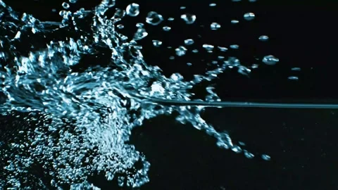 Dynamic Water Splash with Flying Droplets on Dark Background Stock Footage 345678948