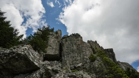 Dynamic white clouds over Ceahlau Mountains ridge, Romania. 4k timelapse. Stock Footage 77139967